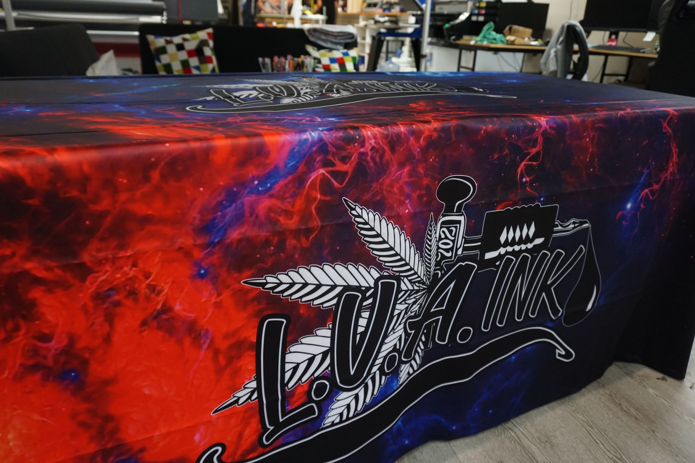 Top view of LVA Ink logo printed edge to edge on a custom table throw