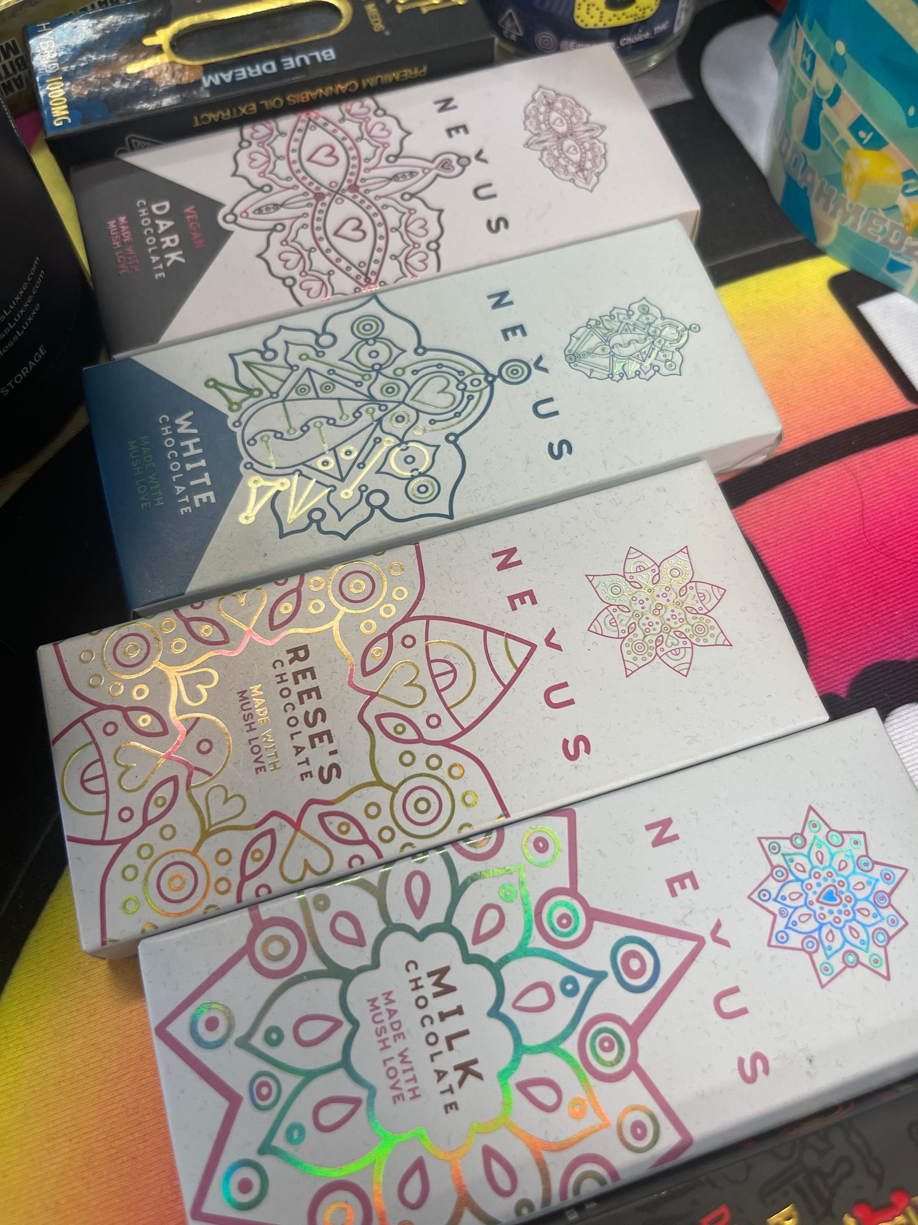 Finished Nexus chocolate boxes with holographic foil accents