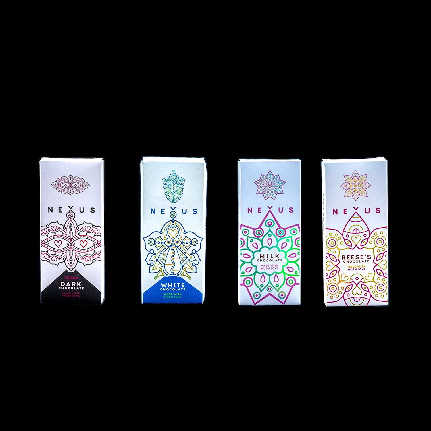 Four Nexus chocolate bar boxes in dark, white, milk and Reese's flavors