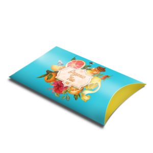 Graphics Design Media custom printed pillow box packaging designed for an organic tea brand with fruit and floral artwork.