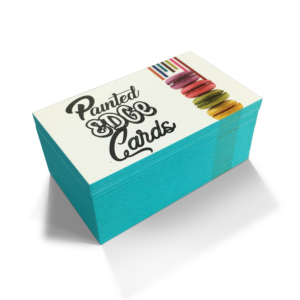 Graphics Design Media painted edge business cards with vibrant teal color coating along the card edges.