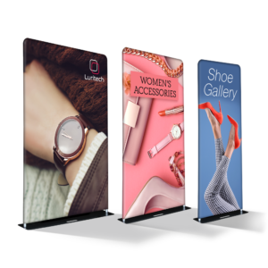 Graphics Design Media tension fabric SEG banner stands displaying full-color trade show graphics in three sizes.
