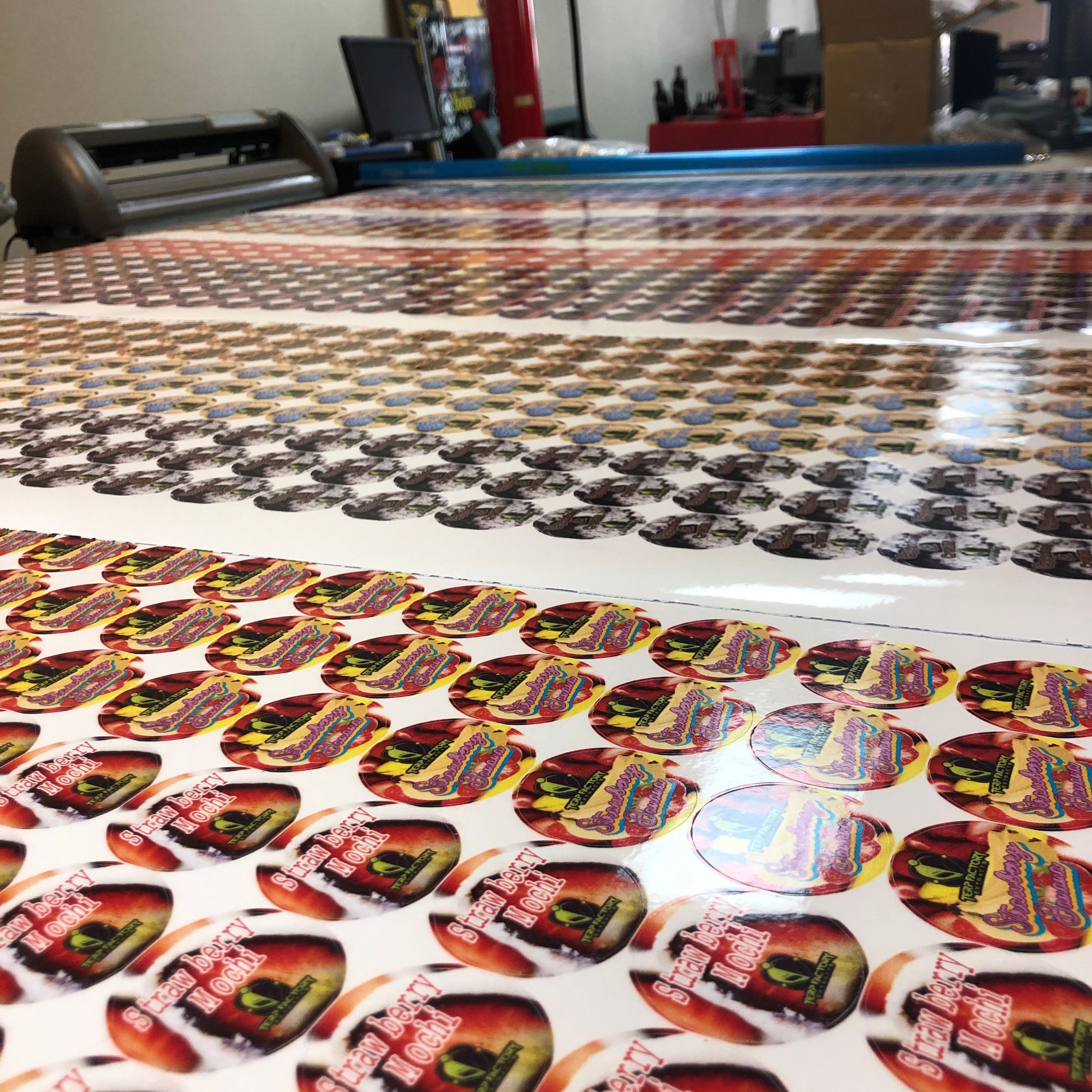 Large format printed sticker sheets fresh off the printer