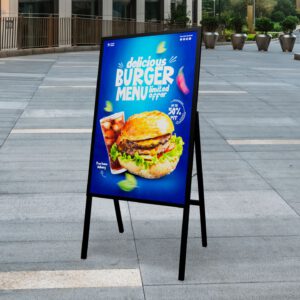 LED backlit A-frame sign with burger menu on a sidewalk