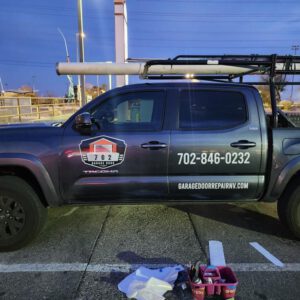 Pickup truck with vinyl logo, phone number and website door lettering