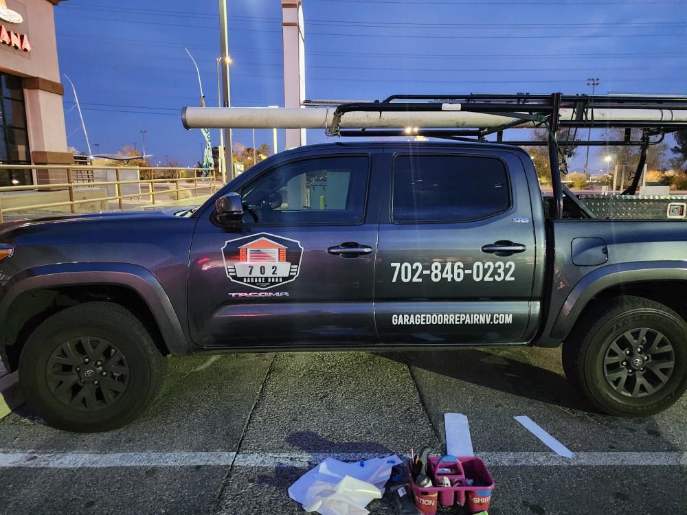 Pickup truck with vinyl logo, phone number and website door lettering