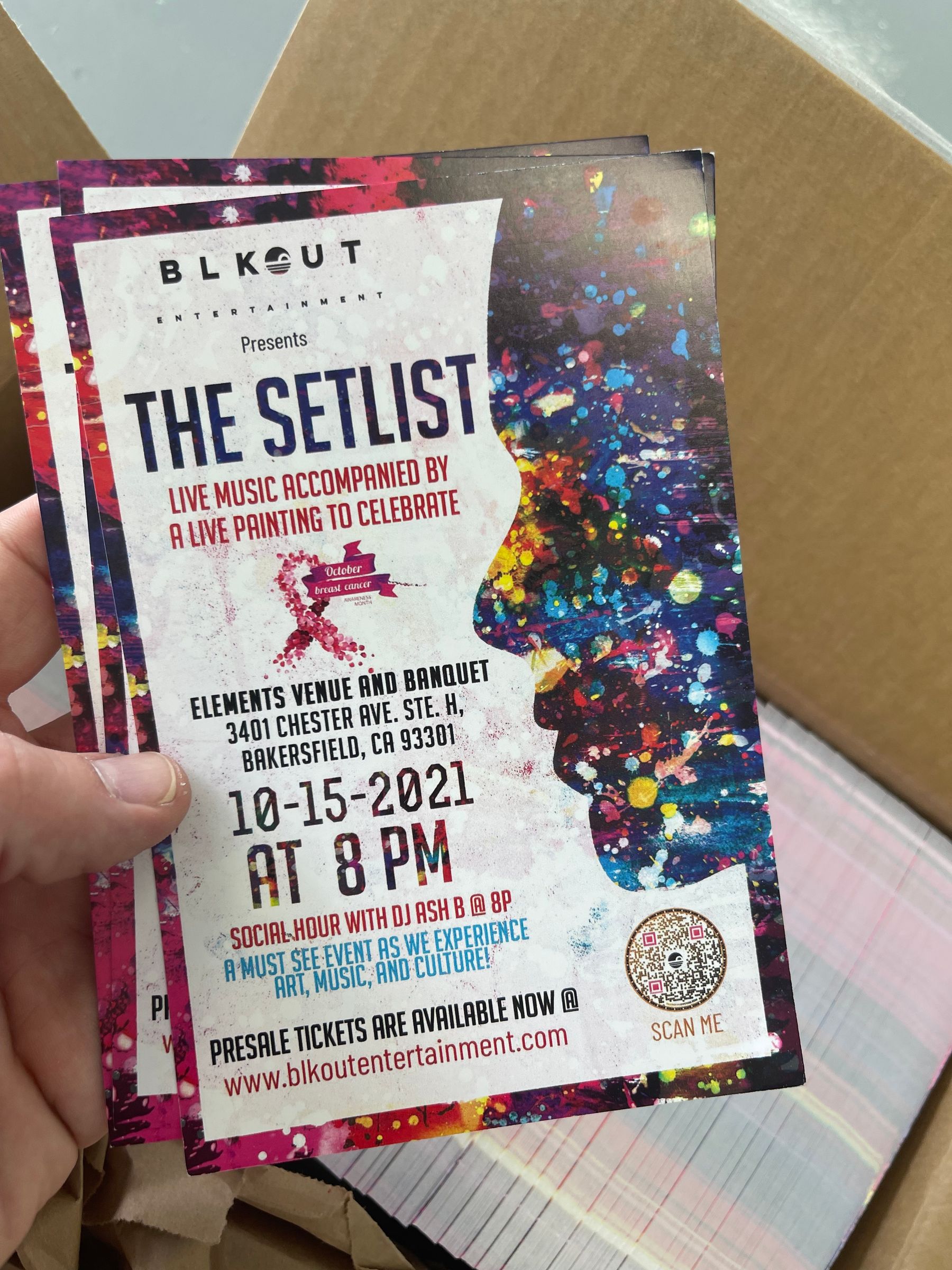 Stack of printed full-color event flyers for The Setlist