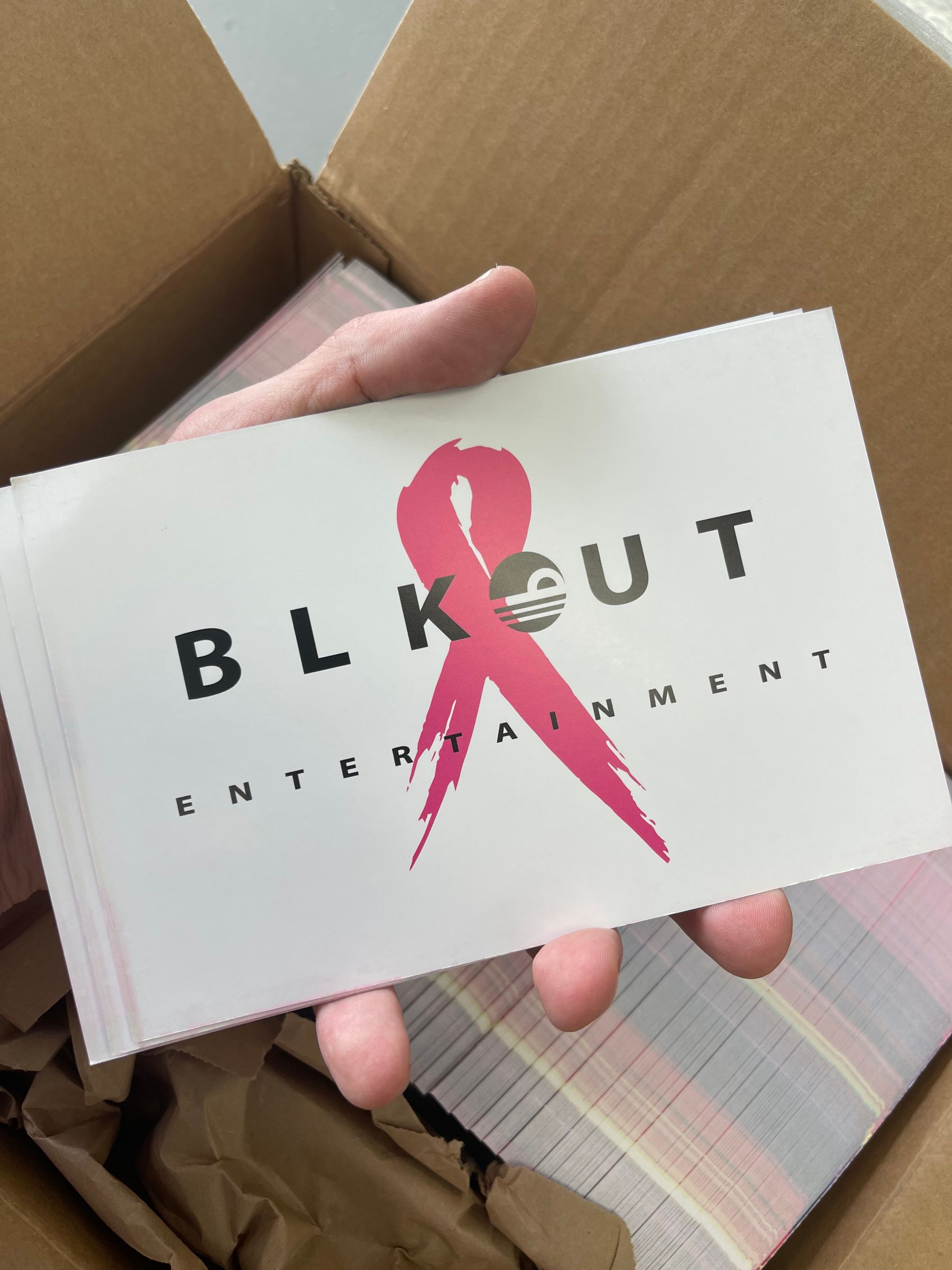 Box of printed BLKOUT Entertainment postcards
