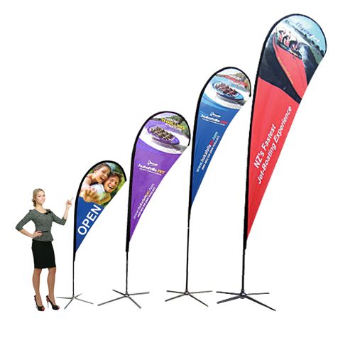 Teardrop flags in four sizes next to a person for scale