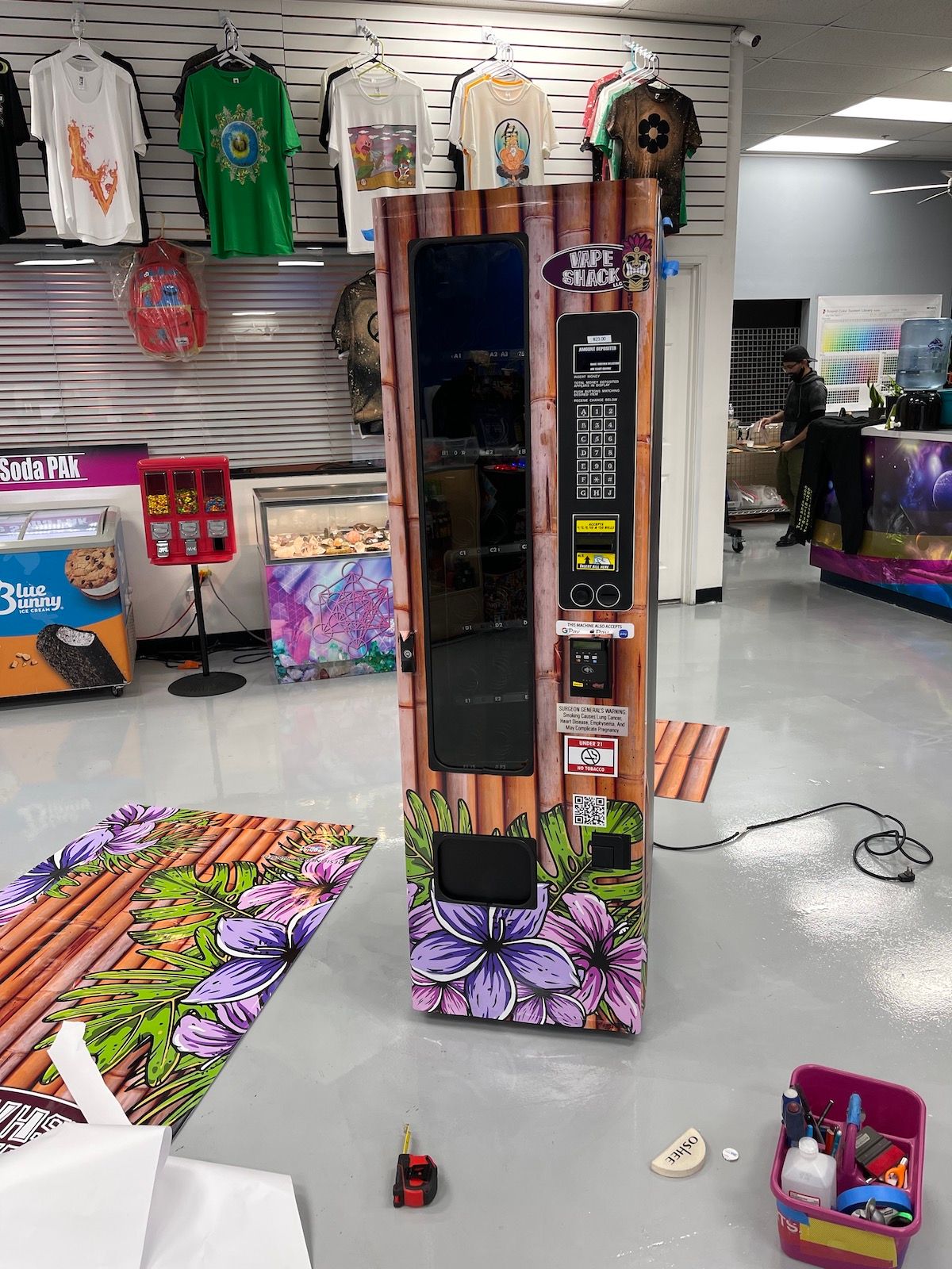 Narrow vending machine with floral and tropical vinyl wrap